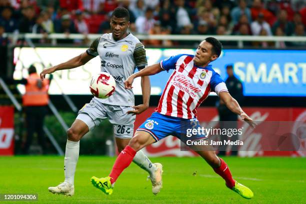 Raul Zuniga of Dorados fights for the ball with Jose Vazquez of Chivas during a match between Chivas and Dorados as part of the Copa MX 2019-20 at...