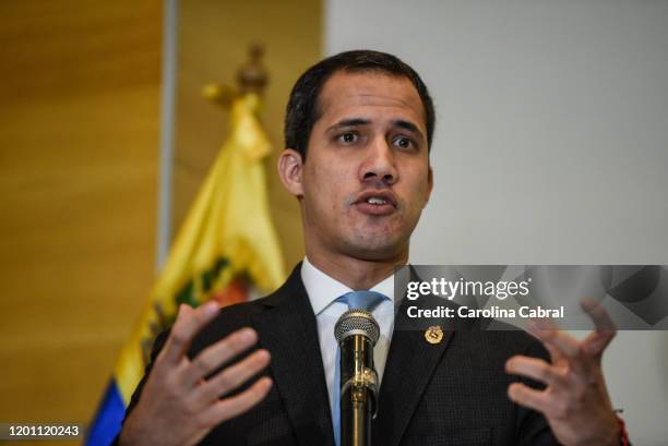 Opposition leader and and reelected president of the National Assembly by anti-Maduro lawmakers majority Juan Guaido speaks during a press conference...