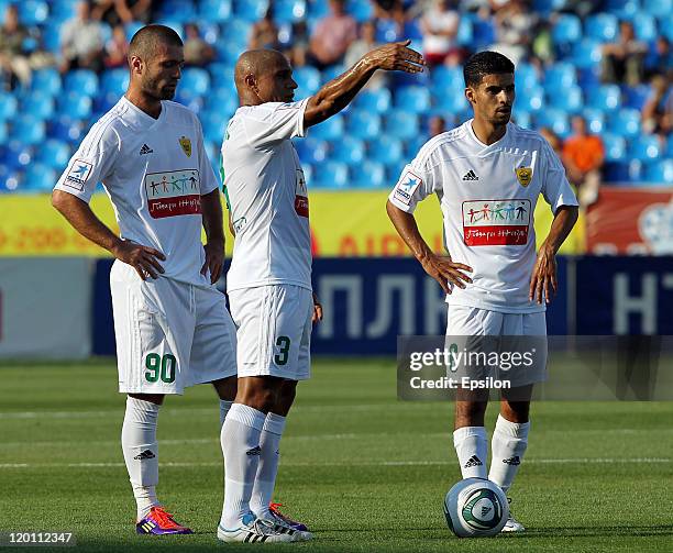 Makhach Gadzhiev , Roberto Carlos and Mbark Boussoufa of FC Anzhi Makhachkala during the Russian Football League Championship match between FC Rubin...