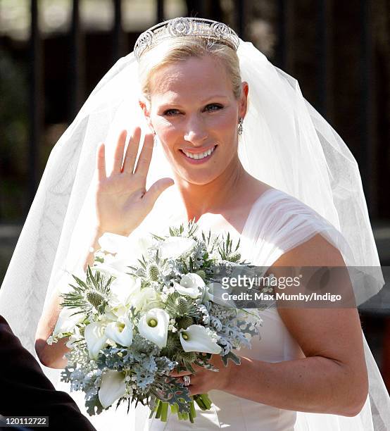 Zara Phillips waves to the crowds as she leaves Canongate Kirk after her wedding to Mike Tindall on July 30, 2011 in Edinburgh, Scotland. The Queen's...