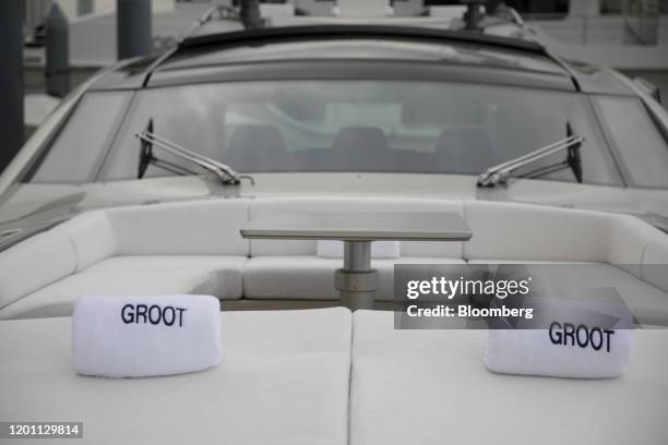 Towels sit on a couch on a deck of the Pershing Groot yacht displayed at the Super Yacht Miami Show in Miami, Florida, U.S., on Friday, Feb. 14,...