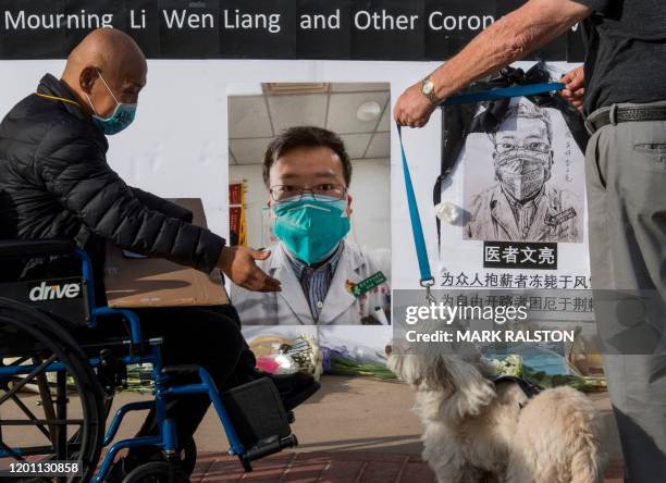 Chinese students and their supporters hold a memorial for Dr Li Wenliang, who was the whistleblower of the Coronavirus, Covid-19, that originated in...