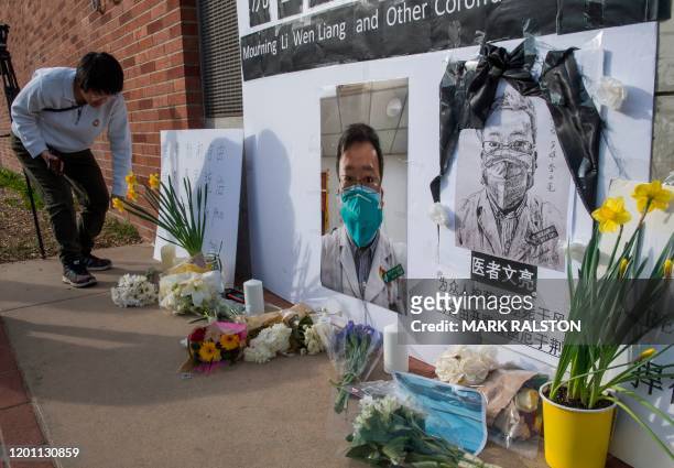 Chinese students and their supporters hold a memorial for Dr Li Wenliang, who was the whistleblower of the Coronavirus, Covid-19, that originated in...