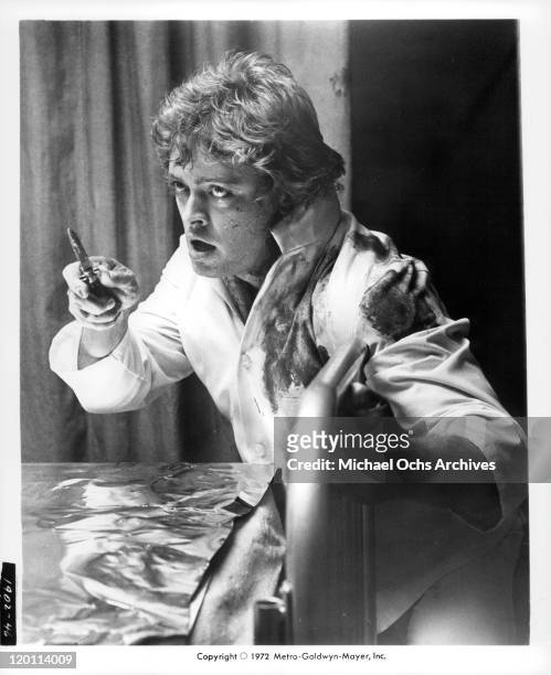Michael Blodgett with knife in a scene from the film 'The Carey Treatment', 1972.