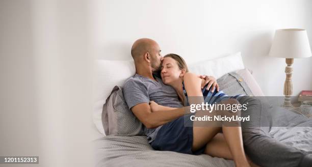 sundays are for cuddling - lazy husband stock pictures, royalty-free photos & images