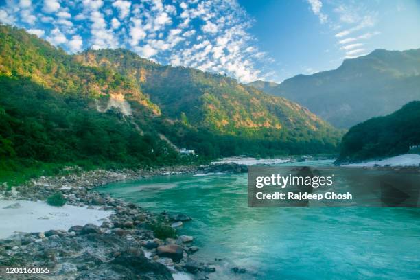 river ganges flowing through rishikesh hills - rishikesh stock pictures, royalty-free photos & images