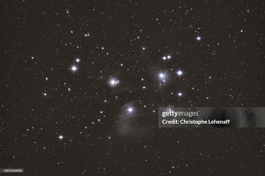 View of the beautiful stars cluster named The Pleiades (M45), in the constellation of Taurus