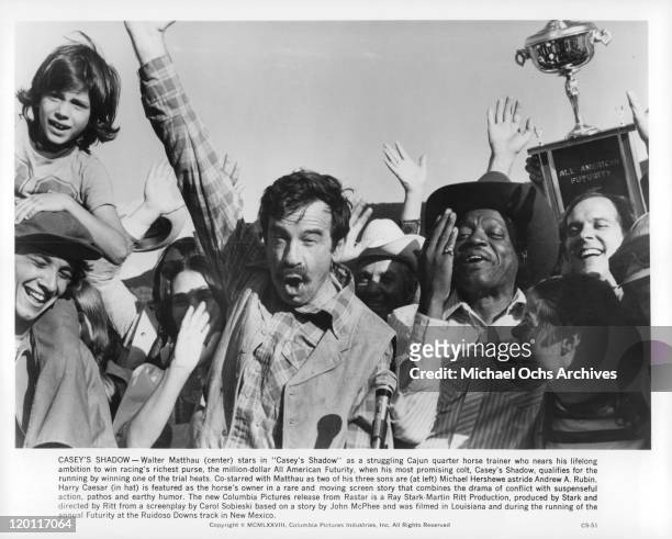 Michael Hershewe, Andrew Rubin, Walter Matthau, Harry Caesar celebrate in a scene from the film 'Casey's Shadow', 1978.