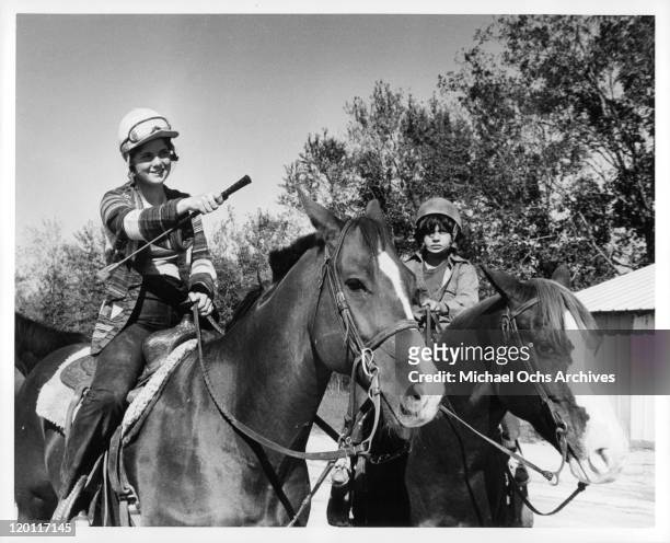 Susan Myers and Michael Hershewe on horseback in a scene from the film 'Casey's Shadow', 1978.