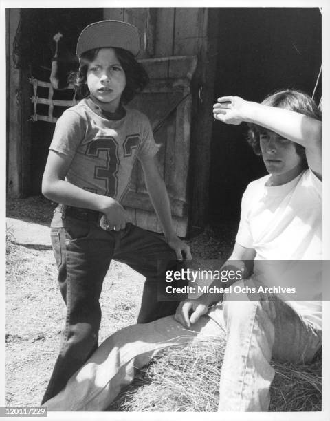 Michael Hershewe with Stephan Burns looking ahead in a scene from the film 'Casey's Shadow', 1978.