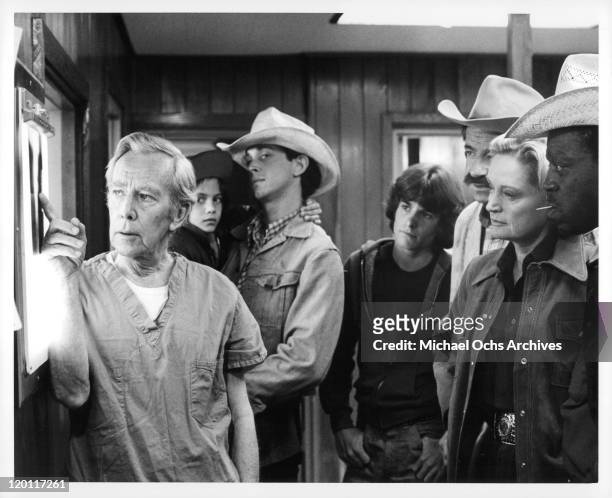 Whit Bissell shows X-Ray as Michael Hershewe, Andrew Rubin, Stephan Burns, Walter Matthau, Alexis Smith, and Harry Caesar watch in a scene from the...