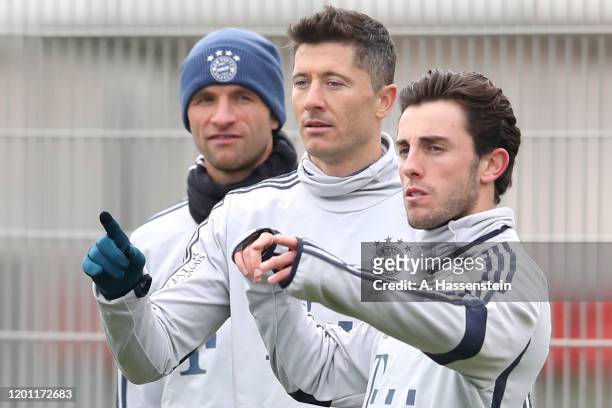 Thomas Mueller, Robert Lewandowski and Alvaro Odriozola of FC Bayern Muenchen during a training session at Saebener Strasse training ground on...
