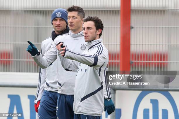 Thomas Mueller, Robert Lewandowski and Alvaro Odriozola of FC Bayern Muenchen during a training session at Saebener Strasse training ground on...