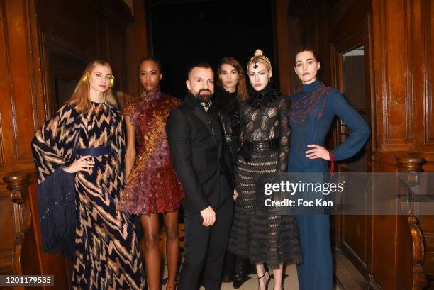 Fashion designer Julien Fournié poses with his models during attends the Julien Fournie Haute Couture Spring/Summer 2020 show as part of Paris...