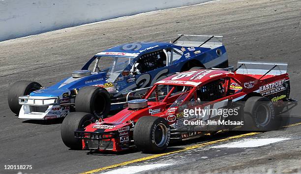 Donny Lia, driver of the Eastport Feeds/LI Fuel Oil Acc. Chevrolet, races against Gary McDonald, driver of the Lakeland Landscaoe/TRC Electric...