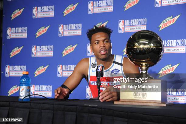 Buddy Hield of the Sacramento Kings talks to the media during a press conference after winning the 2020 NBA All-Star - MTN DEW 3-Point Contest during...
