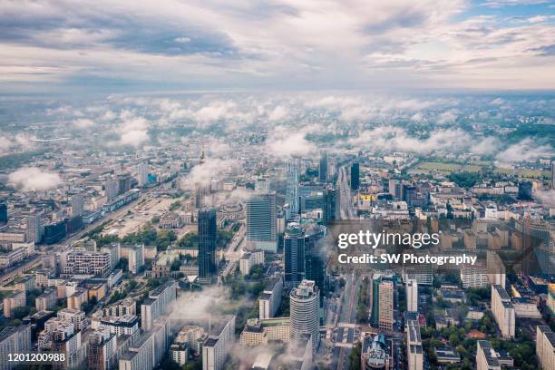 warsaw cityscape above the cloud - warsaw aerial stock pictures, royalty-free photos & images