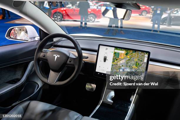 Tesla Model 3 compact full electric car interior with a large touch screen on the dashboard on display at Brussels Expo on January 9, 2020 in...