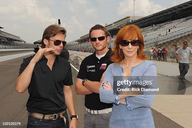 Indianapolis 500 winner Dan Wheldon, Grand-Am Continental Tire Challenge driver Shelby Blackstock and Reba McEntire arrive for the Brickyard 400...