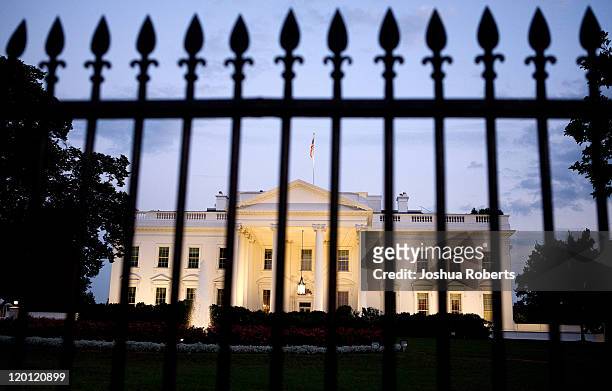 View of the White House is photographed through the gate on July 30, 2011 in Washington, DC. Republican leaders held fresh talks with U.S. President...