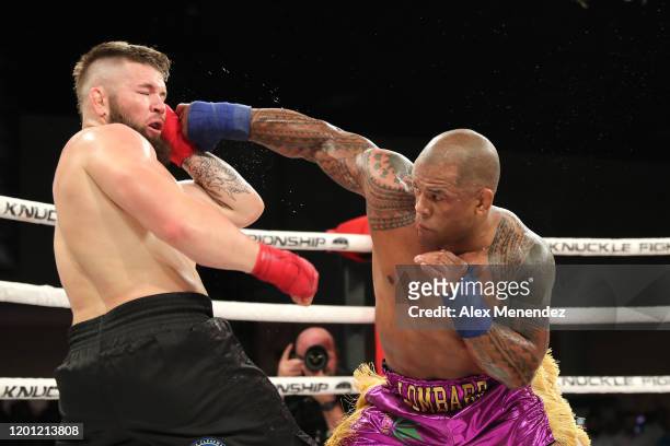 Hector Lombard punches David Mundell during the Bare Knuckle Fighting Championships at Greater Fort Lauderdale Convention Center on February 15, 2020...