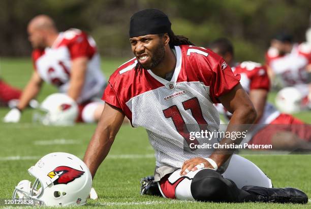 Wide receiver Larry Fitzgerald of the Arizona Cardinals warms up during the team training camp at Northern Arizona University on July 30, 2011 in...