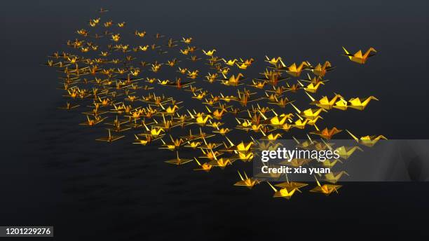 golden origami cranes flying on ship type - 3d bird stock-fotos und bilder