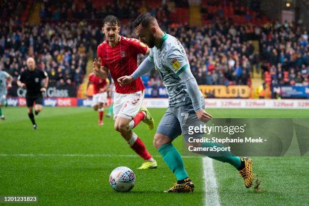 Blackburn Rovers' Adam Armstrong crosses the ball despite the attentions of Charlton Athletic's Tom Lockyer during the Sky Bet Championship match...