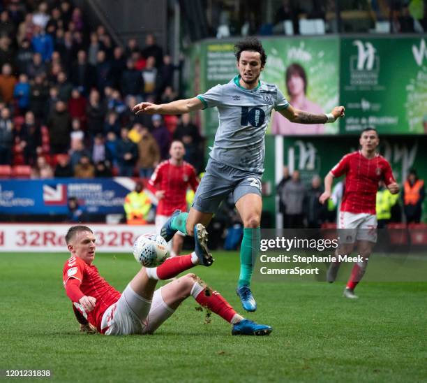 Blackburn Rovers' Lewis Travis is tackled by Charlton Athletic's Alfie Doughty during the Sky Bet Championship match between Charlton Athletic and...