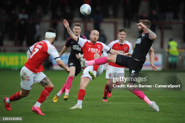 Fleetwood Town's Paddy Madden vies for possession with Peterborough United's Mark Beevers during the Sky Bet League One match between Fleetwood Town...