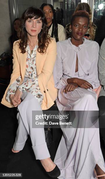 Michele Hicks and Sheila Atim attend the Roland Mouret show during London Fashion Week February 2020 at The National Theatre on February 16, 2020 in...