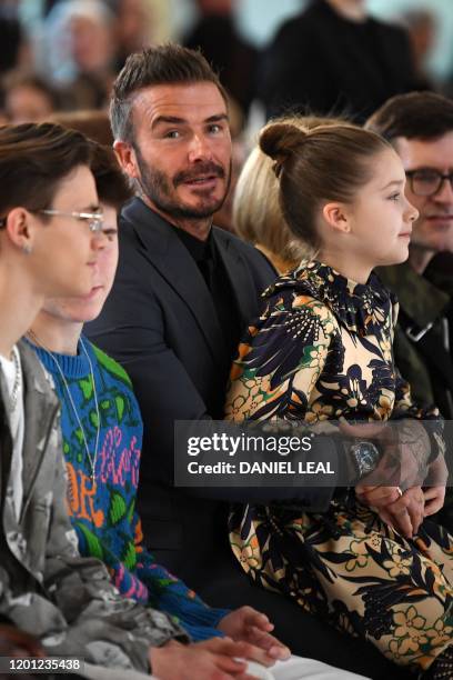 Sons of David and Victoria Beckham, Romeo Beckham and Cruz Beckham , David Beckham and his daughter Harper take their seats in the front row for the...