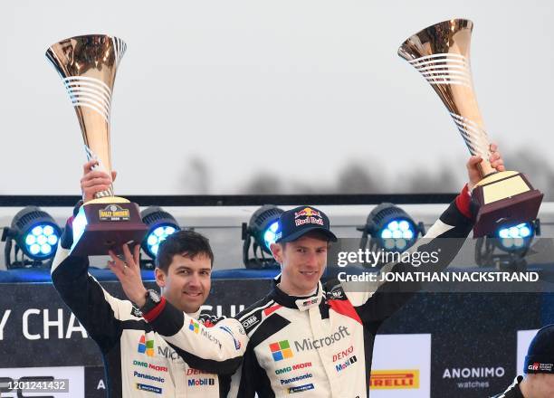 Winning team Scott Martin and Elfyn Evans of Britain celebrate after the Rally Sweden, second round of the FIA World Rally Championship on February...