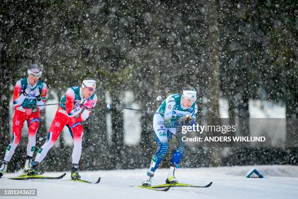 Sweden's Ebba Andersson followed by Norway's Astrid Uhrenholdt Jacobsen and Norway's Heidi Weng during the Women's 10kms Pursuit event during the FIS...