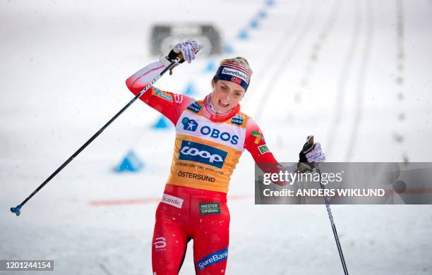 Norway's Theres Johaug crosses the finish line to win the Women's 10kms Pursuit event during the FIS Cross-Country World Cup Ski Tour 2020, in...