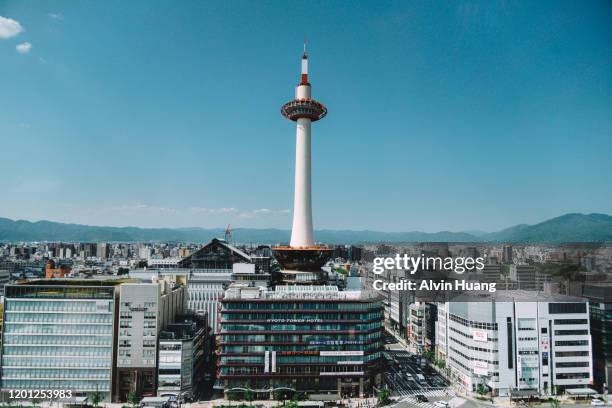 high angle view of kyoto tower against clear blue sky - kyoto station stock pictures, royalty-free photos & images