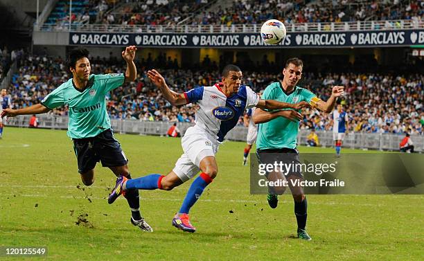 Nick Blackman of Blackburn Rovers chased by Kitchee's players during the Asia Trophy pre-season friendly match at the Hong Kong Stadium on July 30,...