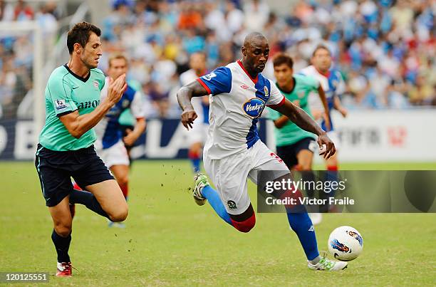 Jason Roberts of Blackburn Rovers and Fernando Recio Comi of Kitchee compete for the ball during the Asia Trophy pre-season friendly match at the...