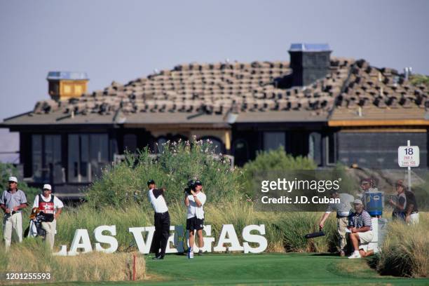 Tiger Woods of the United States tees off on the 18th on his way to his first professional golf tournament win at the PGA Las Vegas Invitational on...