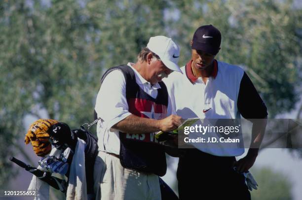 Tiger Woods of the United States with caddy Mike "Fluff" Cowan on his way to his first professional golf tournament win at the PGA Las Vegas...