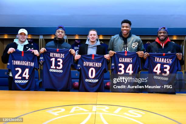 Pat Connaughton, Cameron Reynolds, Donte Divicenzo, Giannis Antetokounmpo and Thanasis Antetokounmpo of the Milwaukee Bucks pose in the Paris...