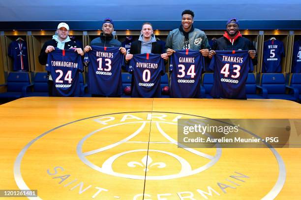 Pat Connaughton, Cameron Reynolds, Donte Divicenzo, Giannis Antetokounmpo and Thanasis Antetokounmpo of the Milwaukee Bucks pose in the Paris...