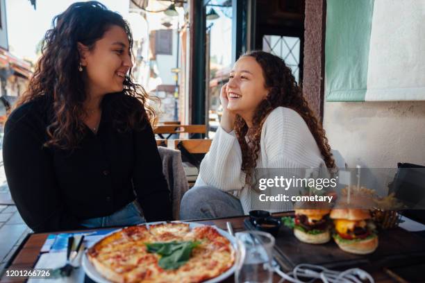 Young Woman Eating Fast Food High-Res Stock Photo