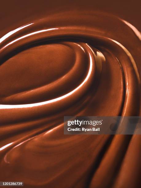 chocolate swirls - chocolate melting stock pictures, royalty-free photos & images