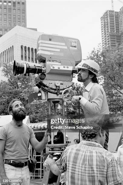 View of American director Martin Scorsese and his camera crew during the filming of 'Taxi Driver,' New York, New York, 1975.
