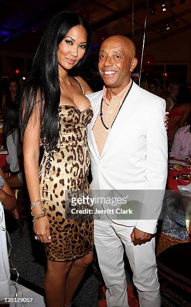 Kimora Lee and Russell Simmons attend the 12th annual Art for Life benefit at a Private Residence on July 30, 2011 in East Hampton, New York.