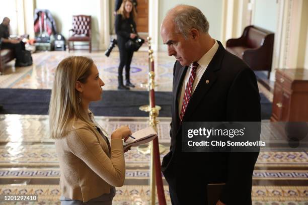 Sen. Robert Casey speaks to a reporter outside the Senate Chamber during a break in President Donald Trump's impeachment trial at the U.S. Capitol...