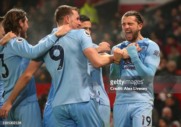 Jay Rodriguez of Burnley celebrates with Chris Wood and teammates after scoring his sides second goal during the Premier League match between...