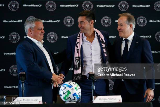 Head coach Diego Alonso of Inter Miami CF shakes hands with Sporting Director Paul McDonough and managing owner Jorge Mas at the Rusty Pelican on...