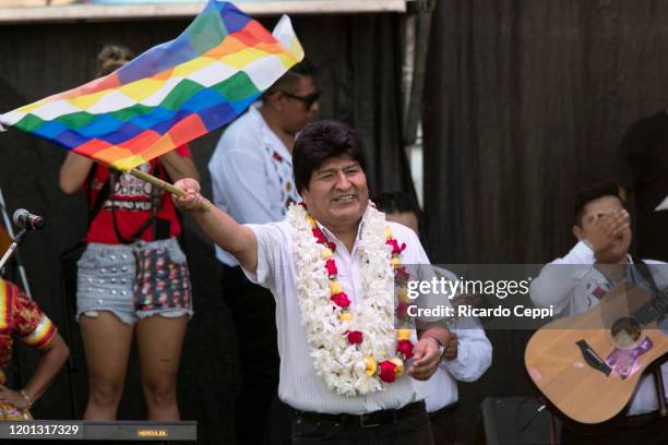 Former president of Bolivia Evo Morales waves a Wiphala flag during an event to celebrate the 14th anniversary of the Plurinational Republic of...